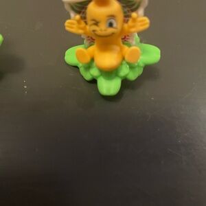 Winking Toy Figure on Green Base Kinder Joy Spinner Figure